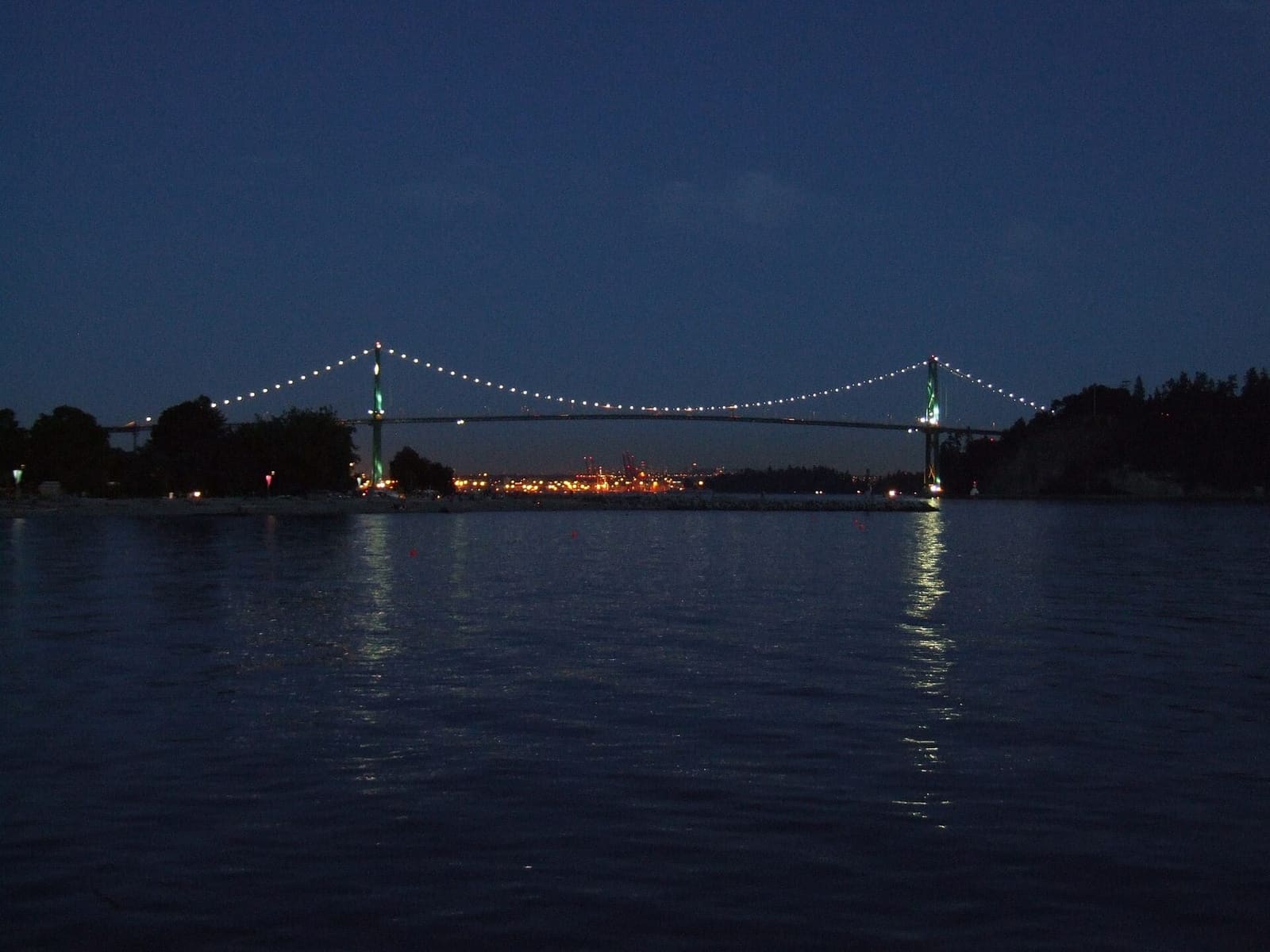 The Lions Gate Bridge and Stanley Park seen from the water
